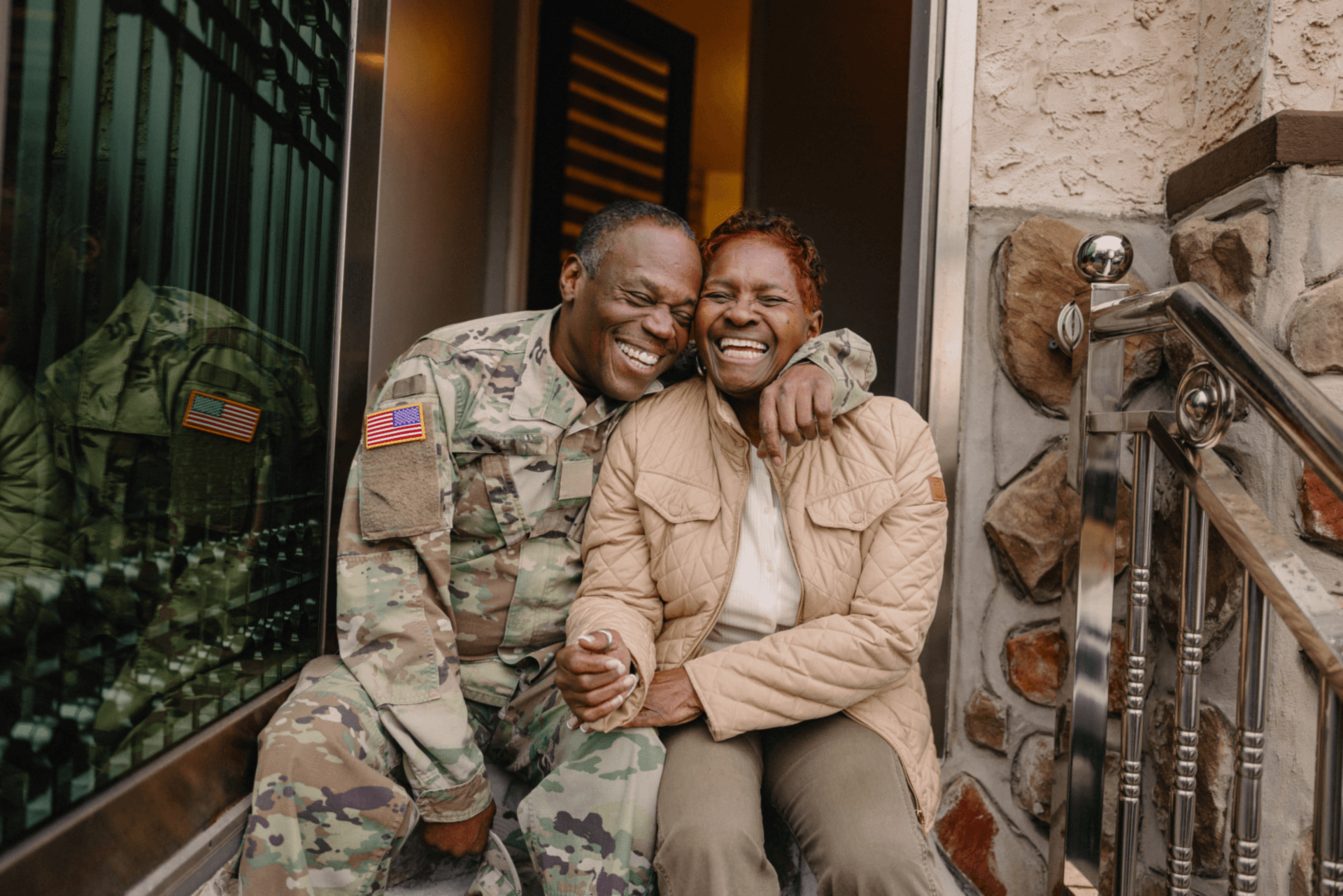 Military husband and wife celebrating homeownership thanks to Rocket